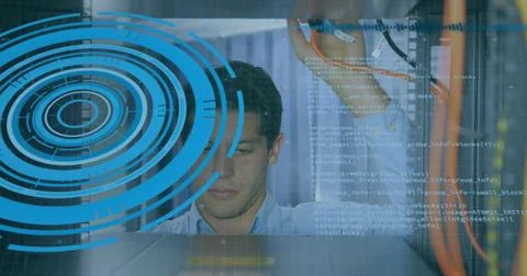 Inspecting Asian man checking patch cables in data center, with digital code Foto stock