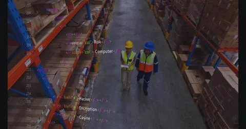 Inspecting boxes two workers using tablet and clipboard among warehouse racks Stock Photos