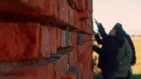 Inspecting brick wall in outdoor setting Stock Footage 301125159