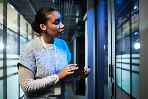 Inspecting Data Center Server Room with Tablet Device Stock Photos