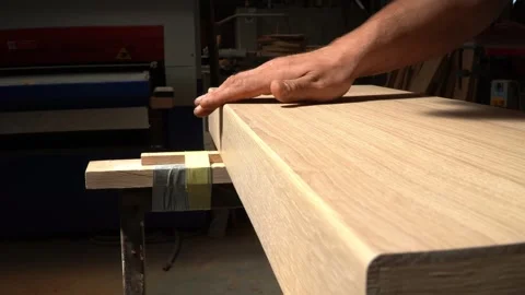 Inspecting the Edge of Sanded Wood Stock-Footage 293542041