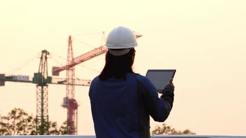 Inspecting Engineer in Construction Site  Stockbeeldmateriaal 124848048