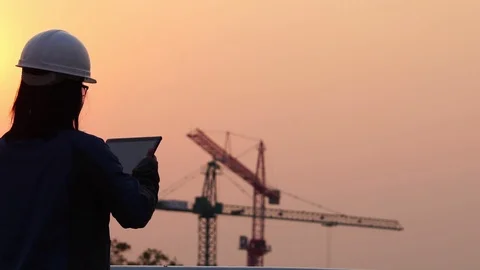 Inspecting Engineer in Construction Site footage slow motion Stock Footage 124847196