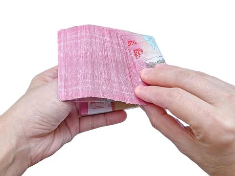 Inspecting Every Note. Scrutinizing the Stack. A Careful Count. Stock Photos