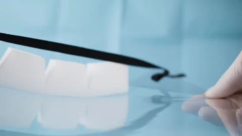 Inspecting a face shield in the hospital. Stockbeeldmateriaal 130326962