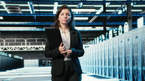Inspecting hardware, blue wireframe mesh rackmounts and manager in data center Stock Footage 329324398