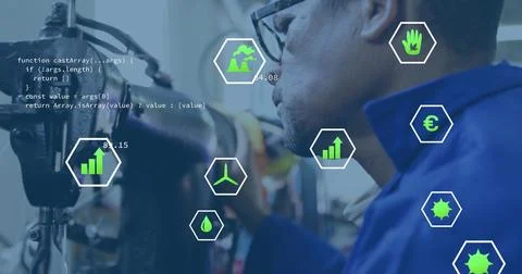 Inspecting hoses, technician wearing work jacket and glasses in factory, with Stock Photos