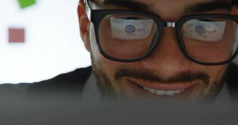 Inspecting laptop screen through glasses in office, with pie chart and helico Stock Photos
