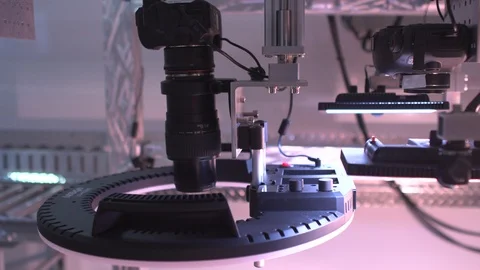 Inspecting a microscope Stock Footage 106957429