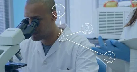 Inspecting scientist in lab coat using microscope in lab, with clipboard pen and Stock Photos