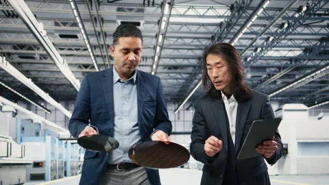 Inspecting semiconductor, electronic component and diverse team of engineers Stock Footage 333392683
