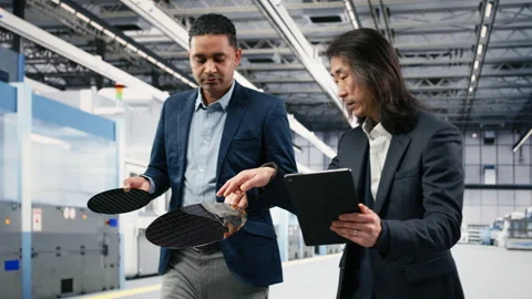 Inspecting semiconductor, electronic component and diverse team of engineers Stock Footage 333395029