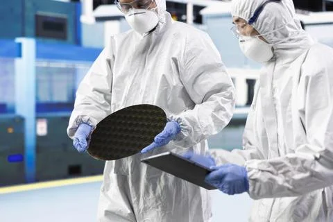 Inspecting semiconductor production, microchip infrastructure and team Stock Photos