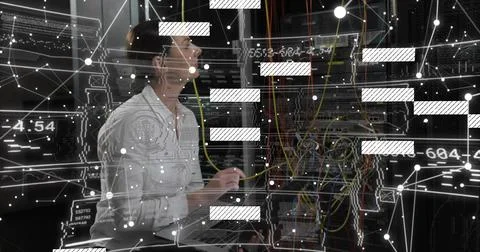 Inspecting server racks, female tech in light shirt checking colorful cables, Foto stock