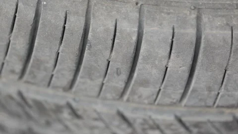 Inspecting tire tread and checking for damage Stock Footage 333988007