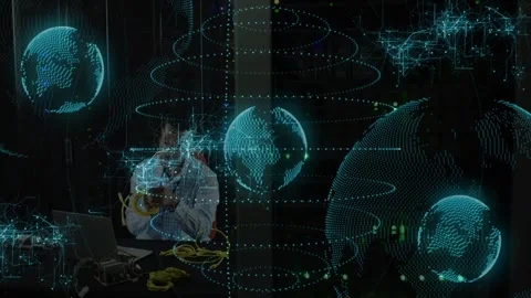 Inspecting unit, tech connecting yellow cables while teal globes expanding Stock Footage 332591854