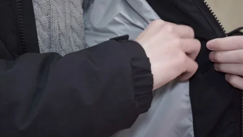 Inspection of the inner pocket of a winter jacket Stock Footage 328966929