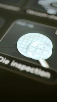 Inspection magnifier covering patterned silicon dies Stock Photos