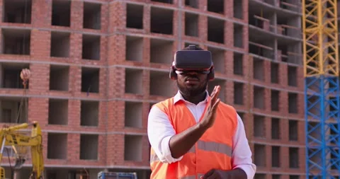 Inspector analyzing the work of builders using virtual reality glasses. . Worker Stock Footage 172289115