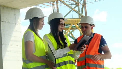 Inspector and worker conduct digital document inspection Stock Footage 317617145