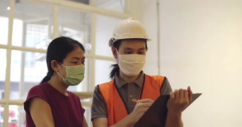 Inspector checking list on work and talk with owner, wearing mask Stock Footage 133905668