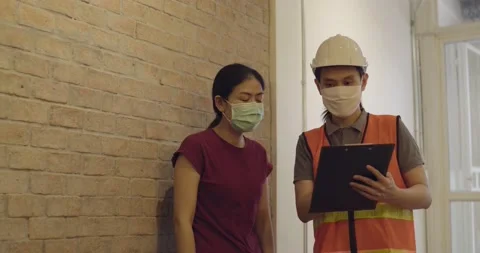 Inspector checking list on work and talk with owner Stock Footage 133906166