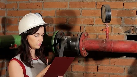 The inspector checks the readings of the manometer. take meter readings Stock Footage 77125532