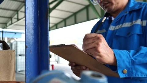 Inspector Engineer is checking equipment and tools placed on shelves inside the  库存影片 318857103