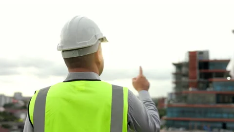 Inspector engineer handsome man or architect looking with white safety helmet in Stock Footage 164839003