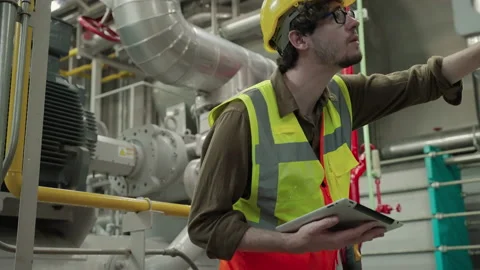 Inspector, Engineer Or the foreman is checking the valve and pipelines Stock Footage 150621835