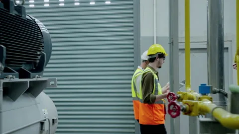 Inspector, Engineer Or the foreman is checking the valve and pipelines Stock Footage 164468013