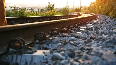 Inspector (engineer) of the railway goes to the west between the rails Stock Footage 96590516