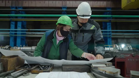 Inspector making the correction marks at schemes by engineer at Industrial plant Stock Footage 154837934