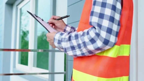 The inspector or engineer is checking the building structure and the order in Stock Footage 217965068