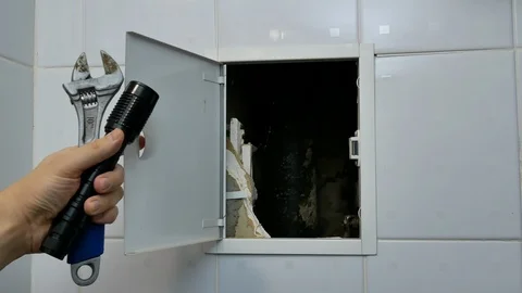 Inspector plumber checking pipeline at hotel room 動画素材 102026786