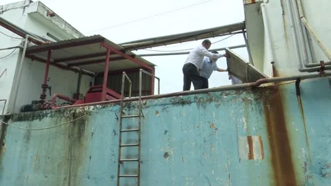 Inspector Points Out Wastewater Piping During Factory Inspection Stock Footage 344950355