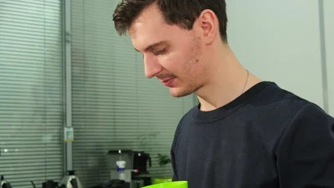 Inspector tastes coffee samples by spitting into plastic glass Stock Footage 269151671