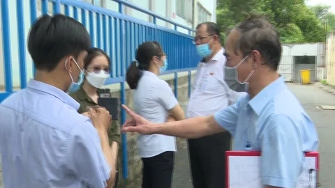 Inspectors Discussing Water Test Results With Factory Officials Outdoor Stock Footage 344950511