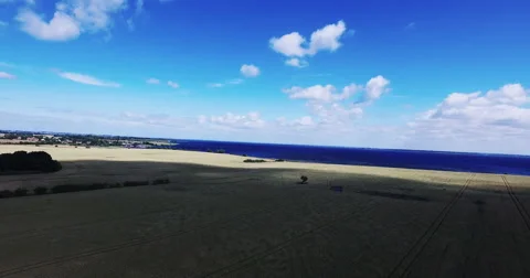 Inspiration - clouds forming shadows on a wheat field 스톡 동영상 65027536