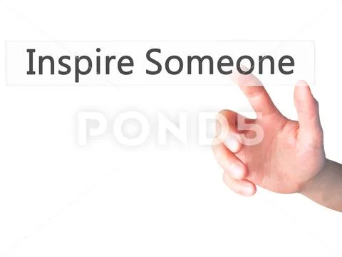 Inspire Someone - Hand pressing a button on blurred background c Stock Photos