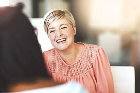 Inspired to continue achieving big things. two businesswomen having a discussion Stock Photos