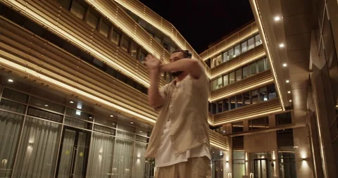Inspired cool man dancing in night city Stock Footage 244475866