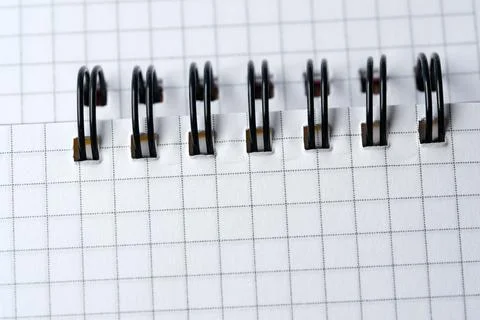 Inspired creativity flows from a grid-patterned notebook 库存照片