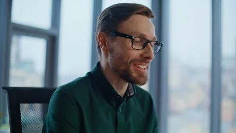 Inspired employee working online typing at laptop near office window closeup. Stock Footage 340294865
