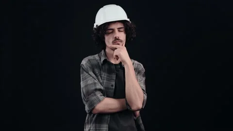 Inspired engineer wearing a special helmet on his head, dressed in a plaid shirt Stock-Footage 150336093