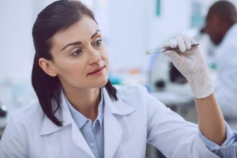 Inspired female bioengineer doing a test with seeds Foto stock