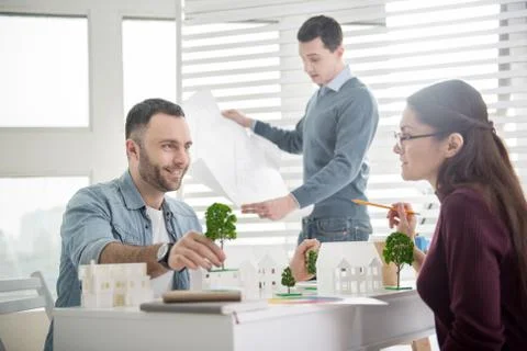 Inspired man working on a project with his colleagues Stock Photos
