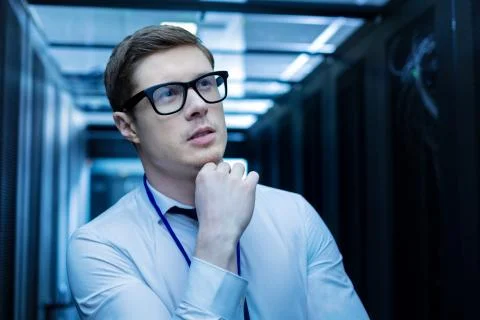 Inspired smart young operator thinking Stock Photos