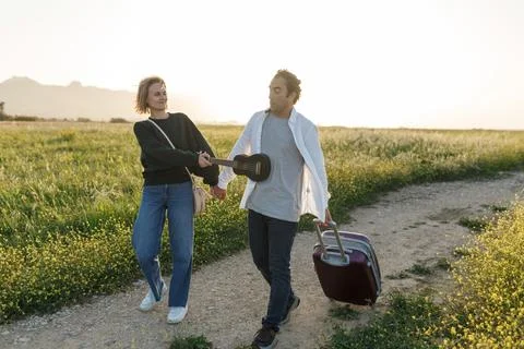 Inspired young loving couple is looking at living plan in future. They are .. Foto stock