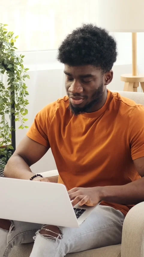 Inspired Young Man Has a Eureka Moment While Working on a Laptop at Home Stock Footage 326631085